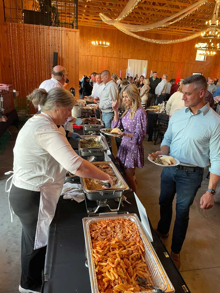 Culinary Capers 2024 guests getting food