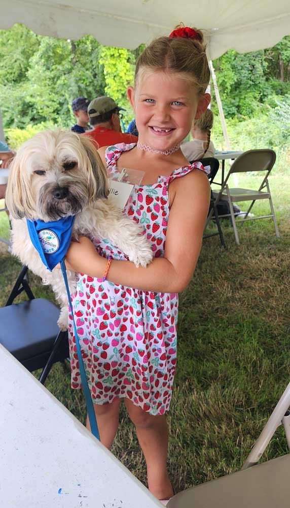 Camp Waves of Hope 2024 animal-assisted therapy dog with girl