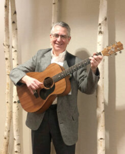 Volunteer Playing Guitar