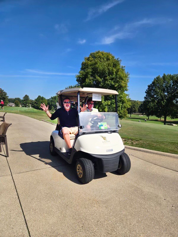 Riding the golf carts at the Golf Classic in Dover, OH